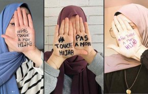 شاهد.. ناشطات فرنسيات: ارفعوا أيديكم عن حجابي