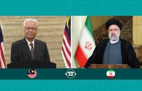  الرئيس الإيراني یبحث مع رئيس وزراء ماليزيا العلاقات الثنائية