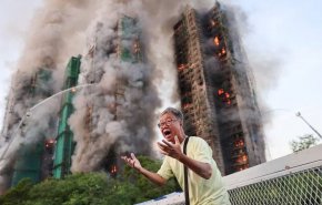 شاهد: 13 قتيلاً و22 مصاباً في حريق بمجمع سكني في هونغ كونغ