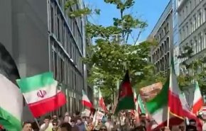 یاد و خاطره‌ی آقای شهید ایران در راهپیمایی  آلمان 
