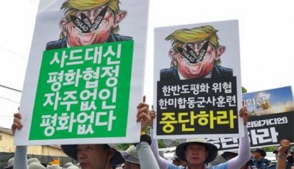 S.Korean Protesters Condemn US Nuclear War Threats against North during Rally
