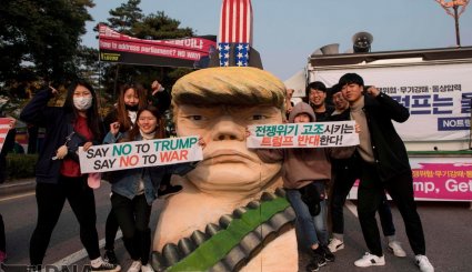 کره جنوبی / ادامه اعتراضات مردمی علیه سفر ترامپ به سئول + تصاویر
