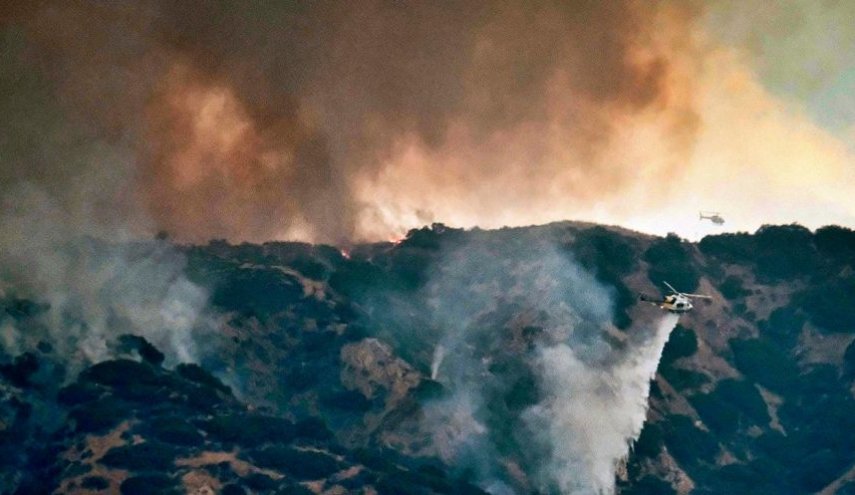 California declares wildfires emergency as thousands flee homes

