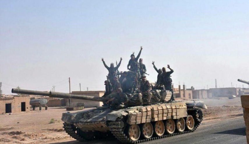 Syrian army battles Isis in al-Mayadin town -report

