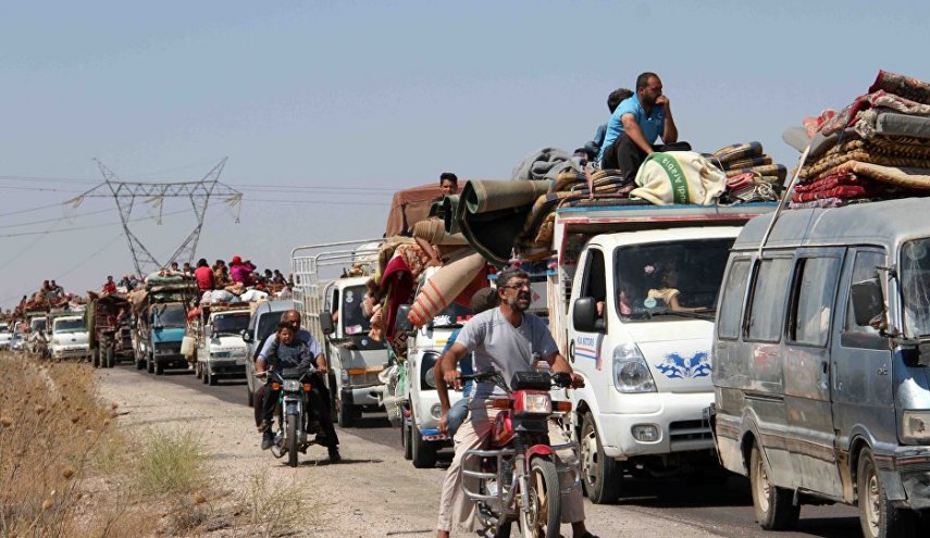 سوريون بالالاف يعودون الى بيوتهم بريفي إدلب وحماة
