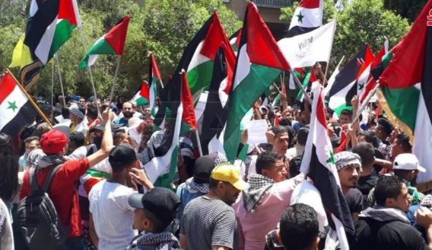 سورية..وقفة تضامنية مع الشعب الفلسطيني أمام مقر الأمم المتحدة بدمشق
