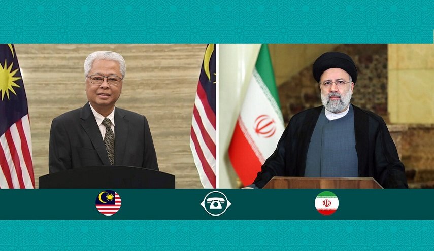  الرئيس الإيراني یبحث مع رئيس وزراء ماليزيا العلاقات الثنائية