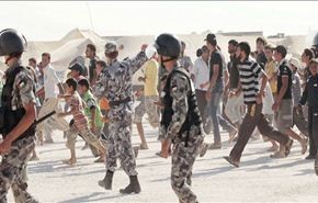 جرحى بقمع الدرك الاردني للاجئين سوريين