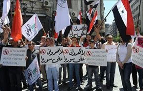 السوريون يتظاهرون بدمشق ضد العدوان الغربي المحتمل