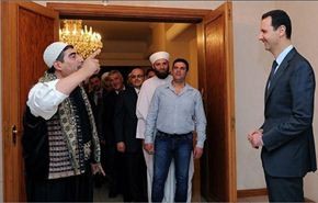 من هو المعارض السوري الذي زار الرئيس الاسد ووقف امامه ينشده؟