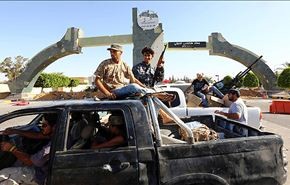 قتلى وجرحى باشتباكات في بنغازي وميليشيات تسيطر على العاصمة