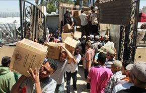 قافلة مساعدات أنسانية تدخل حي الوعر في مدينة حمص+صور