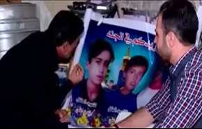 محزن للغاية.. عراقي يكلم صور أطفاله 