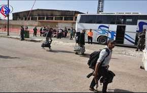 بالصور.. خروج الدفعة السابعة للمسلحين من حي الوعر بحمص