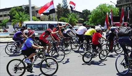 Syrians Take Part in Cycling Marathon to Mark Martyrs' Day in Damascus