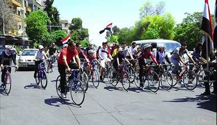 Syrians Take Part in Cycling Marathon to Mark Martyrs' Day in Damascus