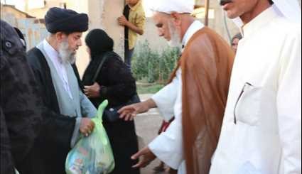 بالصور..توزيع المساعدات الغذائية والانسانية على النازحين في تكريت العراق