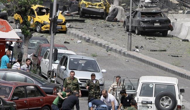 عشرات القتلى والجرحى بانفجار سيارتين مفخختين في حمص