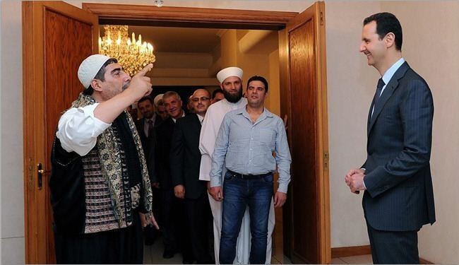 من هو المعارض السوري الذي زار الرئيس الاسد ووقف امامه ينشده؟