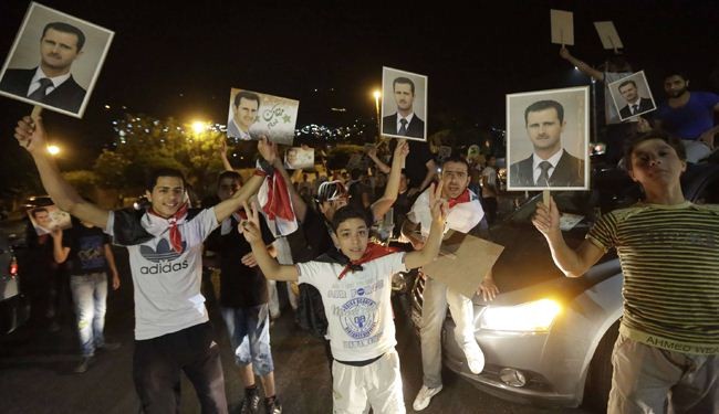 بالصور: احتفالات سوريا ابتهاجا لفوز الأسد بانتخابات الرئاسة