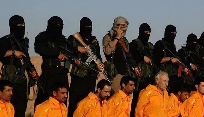 بالصور/داعش يعدم 11 عنصرا من الحشد الشعبي بالعراق
