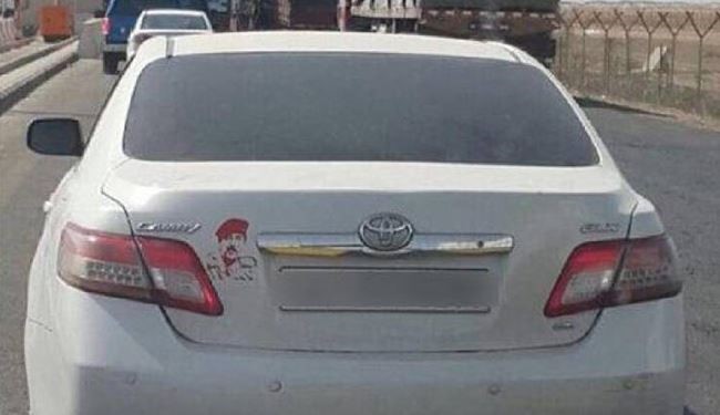 بالصورة؛ ضبط سعودي ألصق صورة صدام على سيارته بالكويت