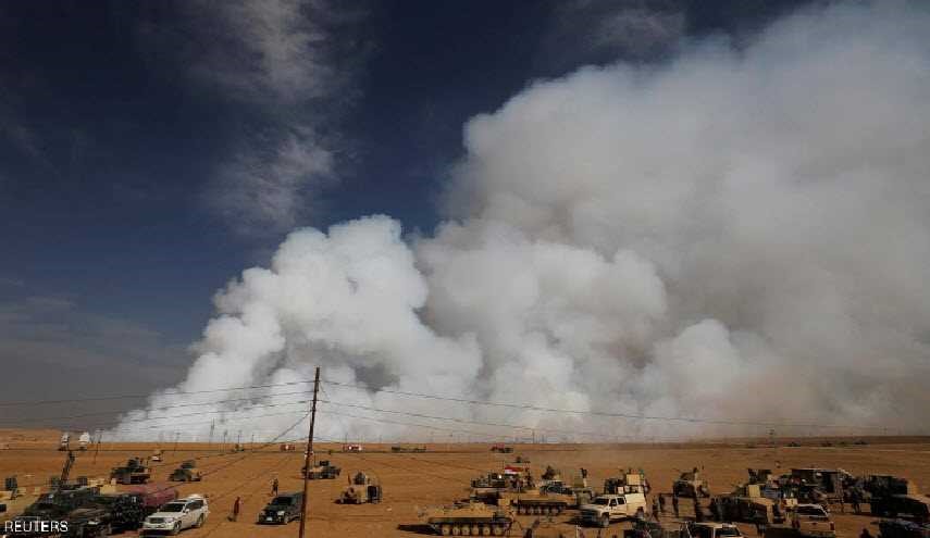 الموصل.. انبعاثات سامة وقوات أميركية ترتدي الأقنعة