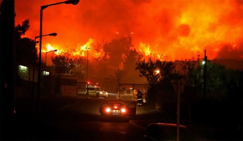وصول الحرائق الى ضواحى تل أبيب وإغلاق مطار بن غوريون