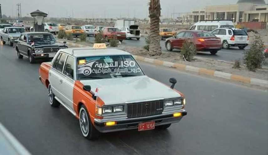 شاهد بالصور استعراض لسيارات قديمة في شوارع بغداد