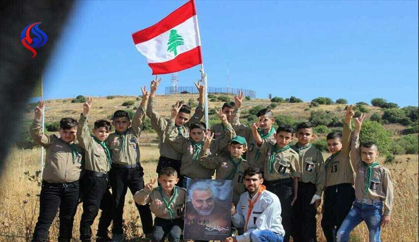 بالصورة.. اشبال كشافة لبنان يحملون صورة سليماني على بعد 300 متر من الصهاينة
