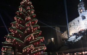 بالصور.. إضاءة شجرة الميلاد في دير السيدة بصيدنايا في سوريا