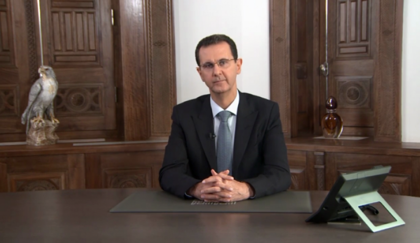 الرئاسة السورية تكشف معاني الرموز التي ظهرت خلف الرئيس الأسد