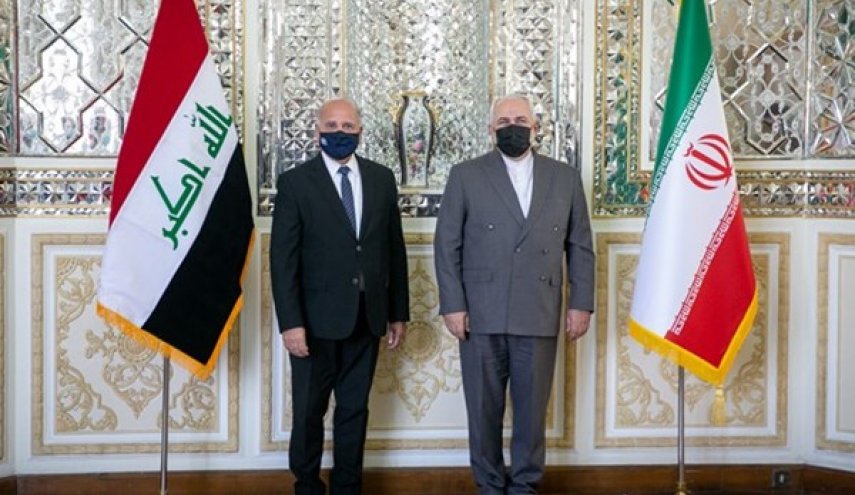 ظريف يبحث مع نظيره العراقي توطيد العلاقات الثنائیة