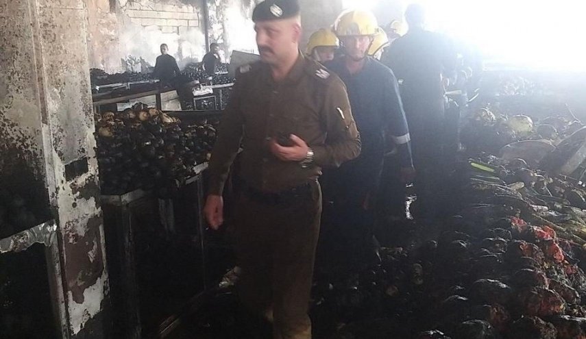 السيطرة على حريق سوق المحمودية في بغداد

