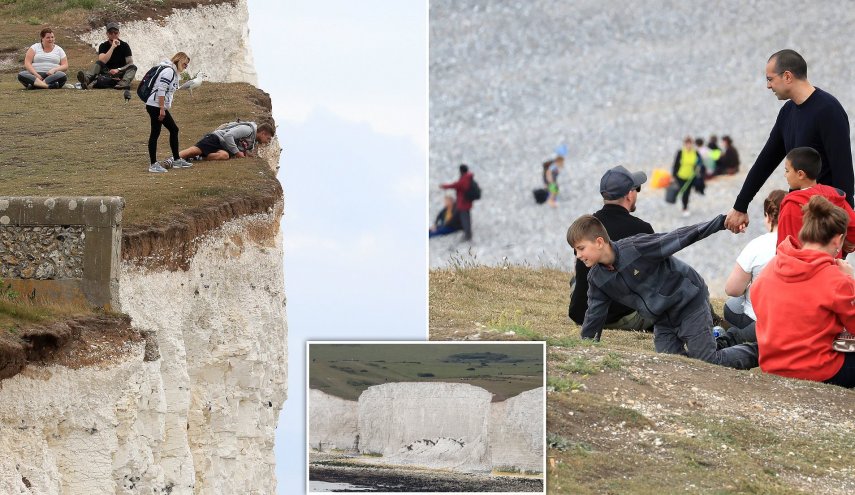 بالصور..سياح يخاطرون بحياتهم لالتقاط صورة سيلفى على حافة منحدر ببريطانيا