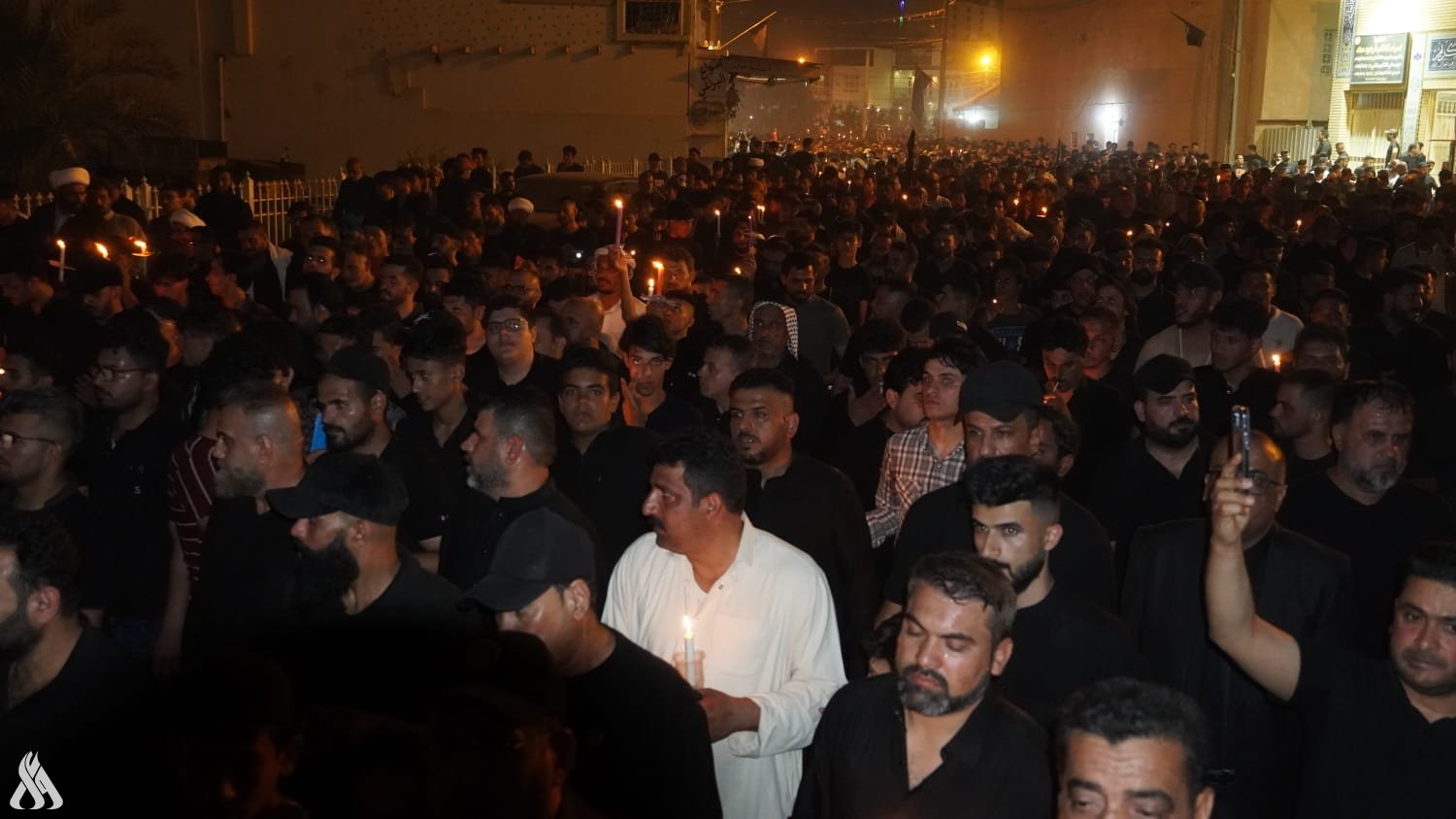 مسيرة الشموع بذكرى استشهاد السيد الصدر ونجليه +صور